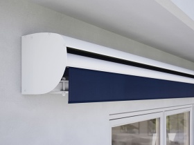 Blue awning with a white aluminium protective covedring